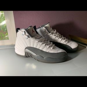 gray and white Jordan 12s